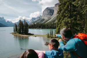 3 people pointing at Spirit Island